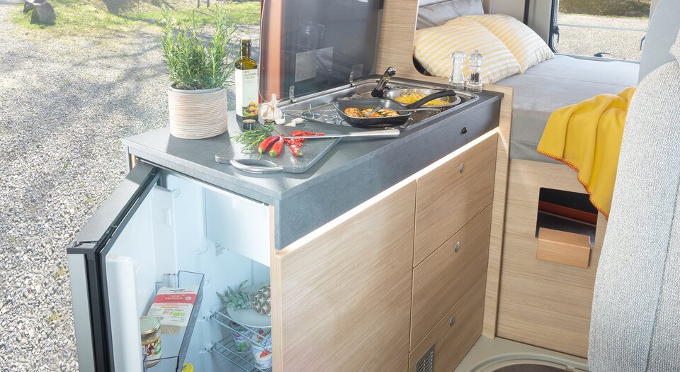 Practical kitchen | Double-hinged refrigerator for easy access from inside and outside the vehicle